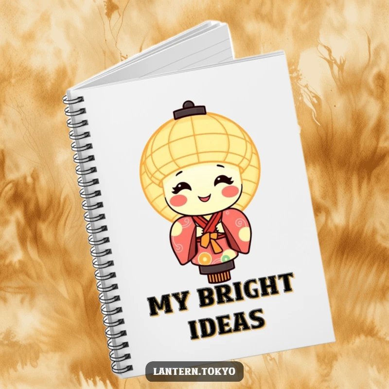 Funny notebook with a round, smiling, glowing lantern character wearing a colorful kimono, inspiring creativity.